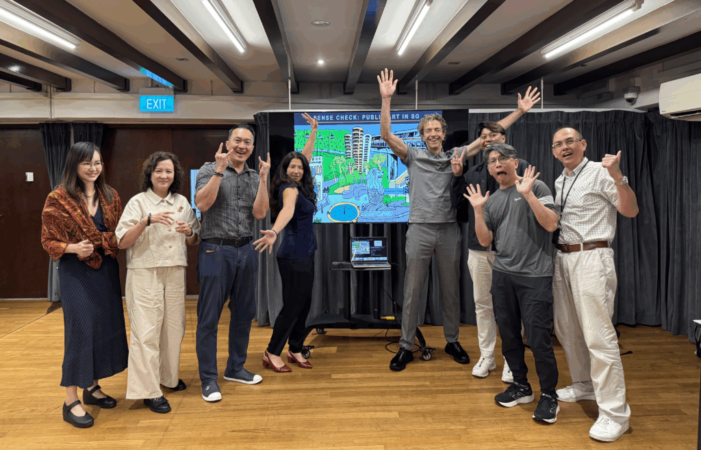 Photo of public art experts and leaders in Singapore with City People team. They are standing in front of a powerpoint slide which reads 'Sense Check: Public Art in Singapore